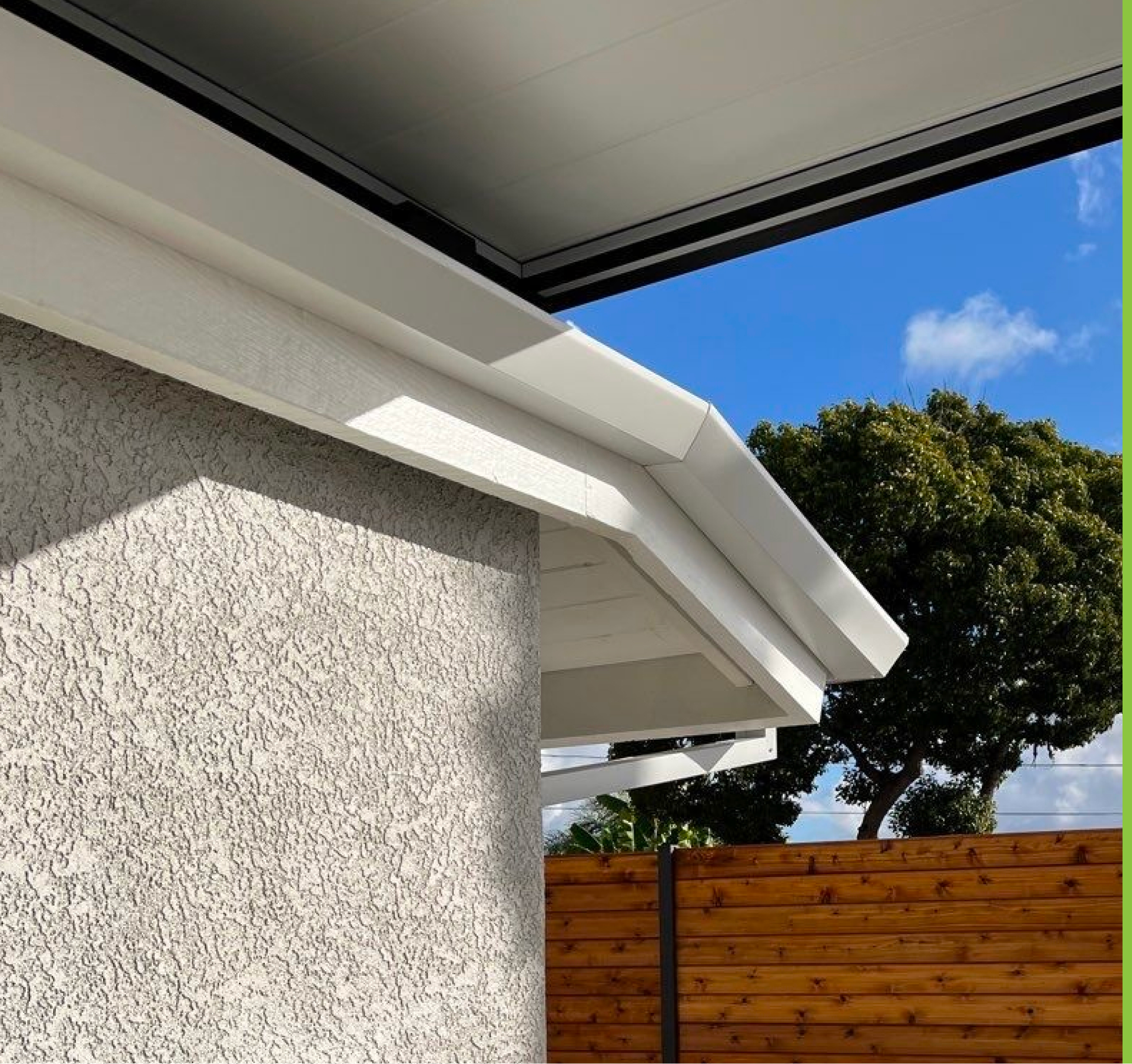Close-up of a factory-coated NexGen S.M.P. aluminum seamless gutter run on a San Diego home, showing an even color finish along the fascia.